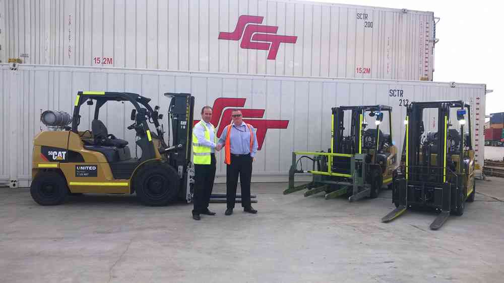 United Victorian State Manager, Brett Whelan, handing over Cat forklifts to SCT National Fleet Manager, Michael Sommers